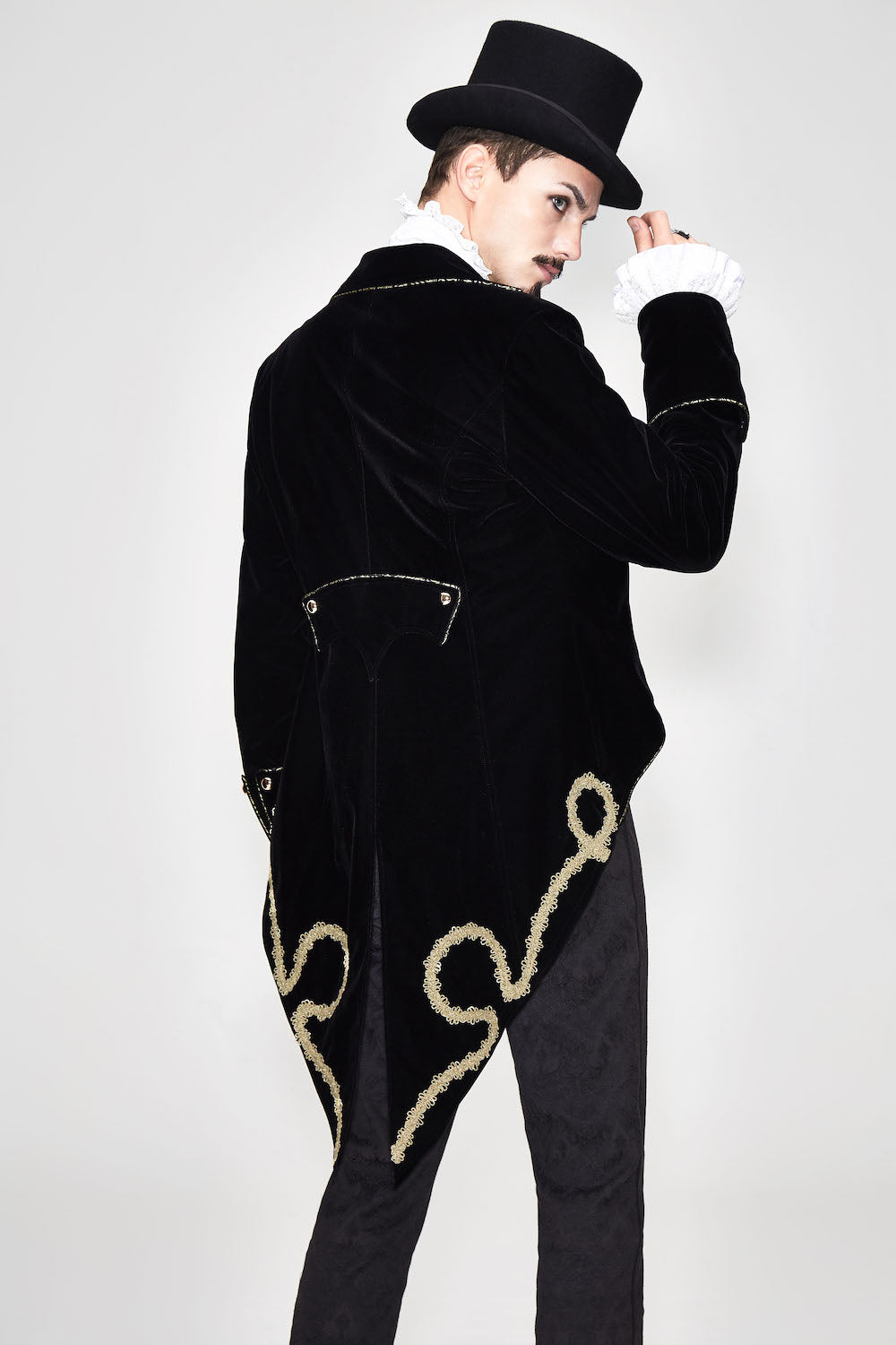 CT099 Bad Boy Baroque tailcoat jacket by Devil Fashion. Gold braid detail, black velvet, sharp tailoring, back view