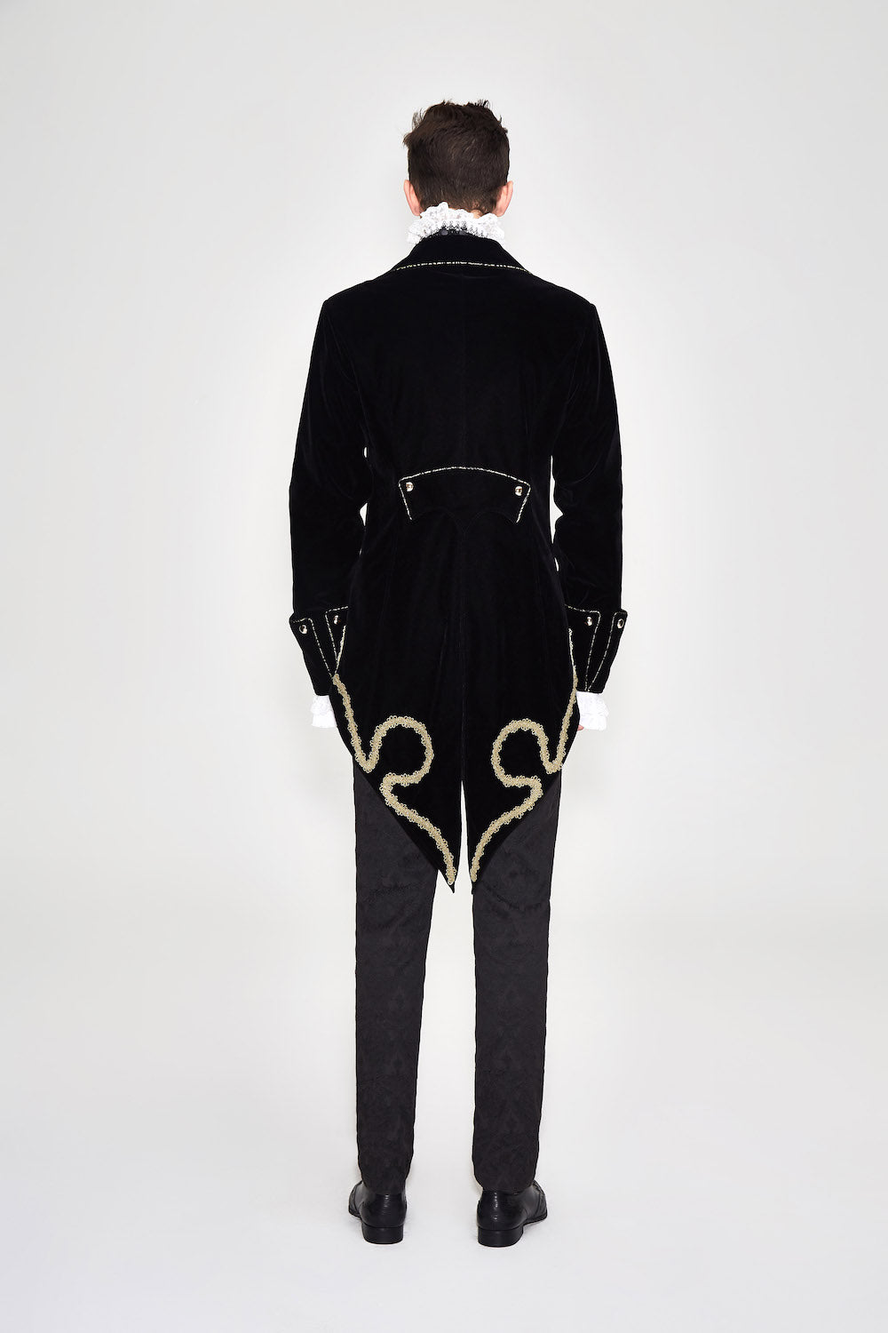 CT099 Bad Boy Baroque tailcoat jacket by Devil Fashion. Gold braid detail, black velvet, sharp tailoring, back view on model